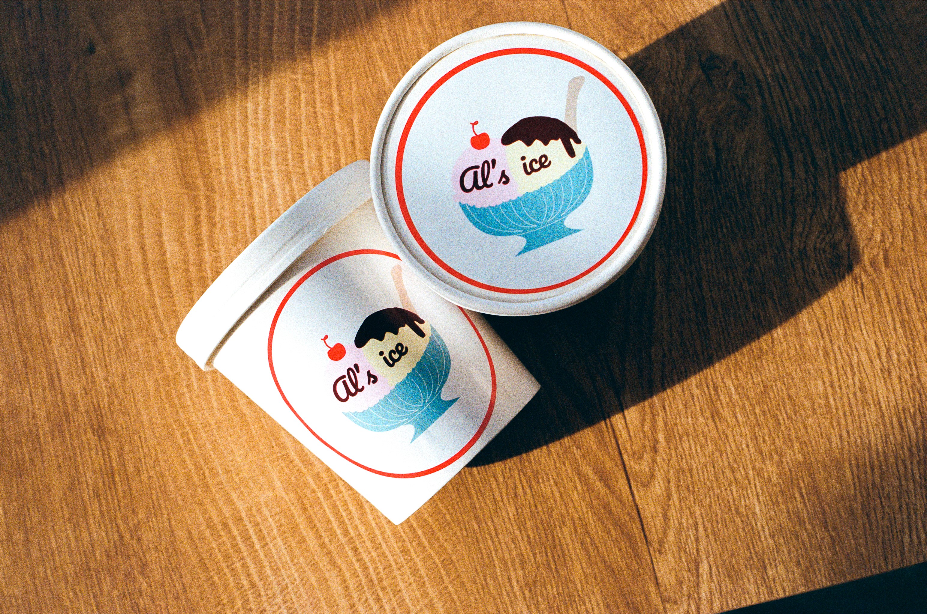 Pastel ice cream packaging design with retro typography on pink background