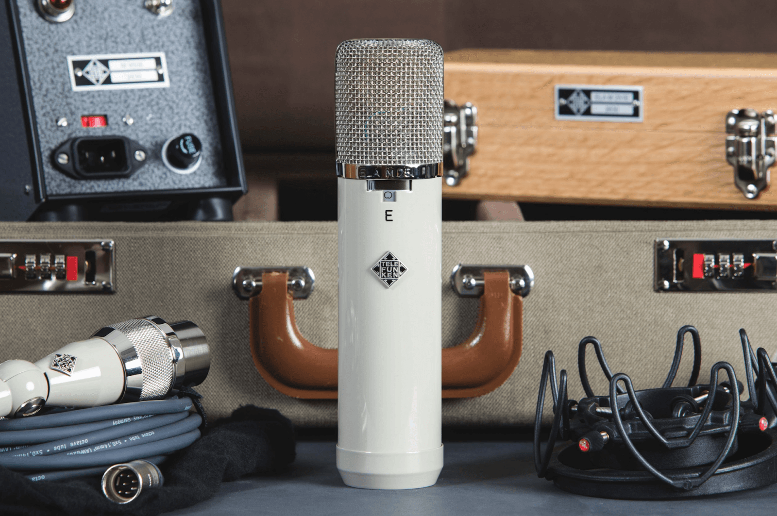 A microphone next to other audio processing equipment