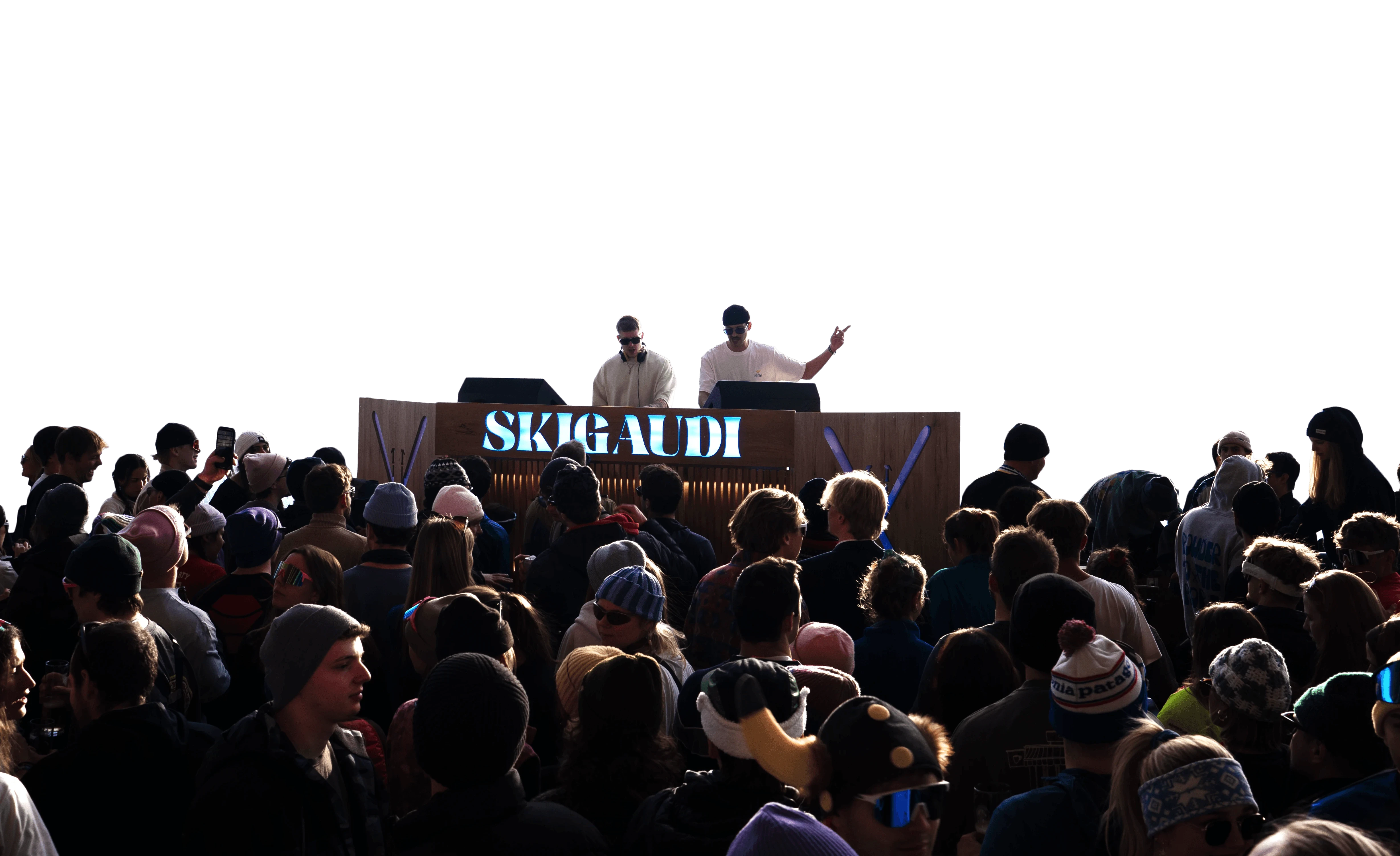 SkiGaudi DJ performance with crowd at lively outdoor event.