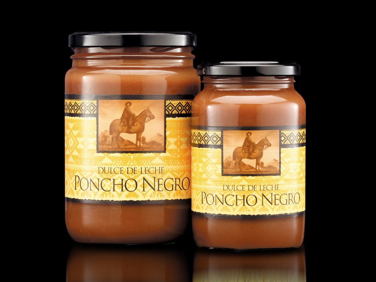 Rustic cabin in a golden field at sunset