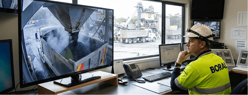 Man watching the security footage on a construction site