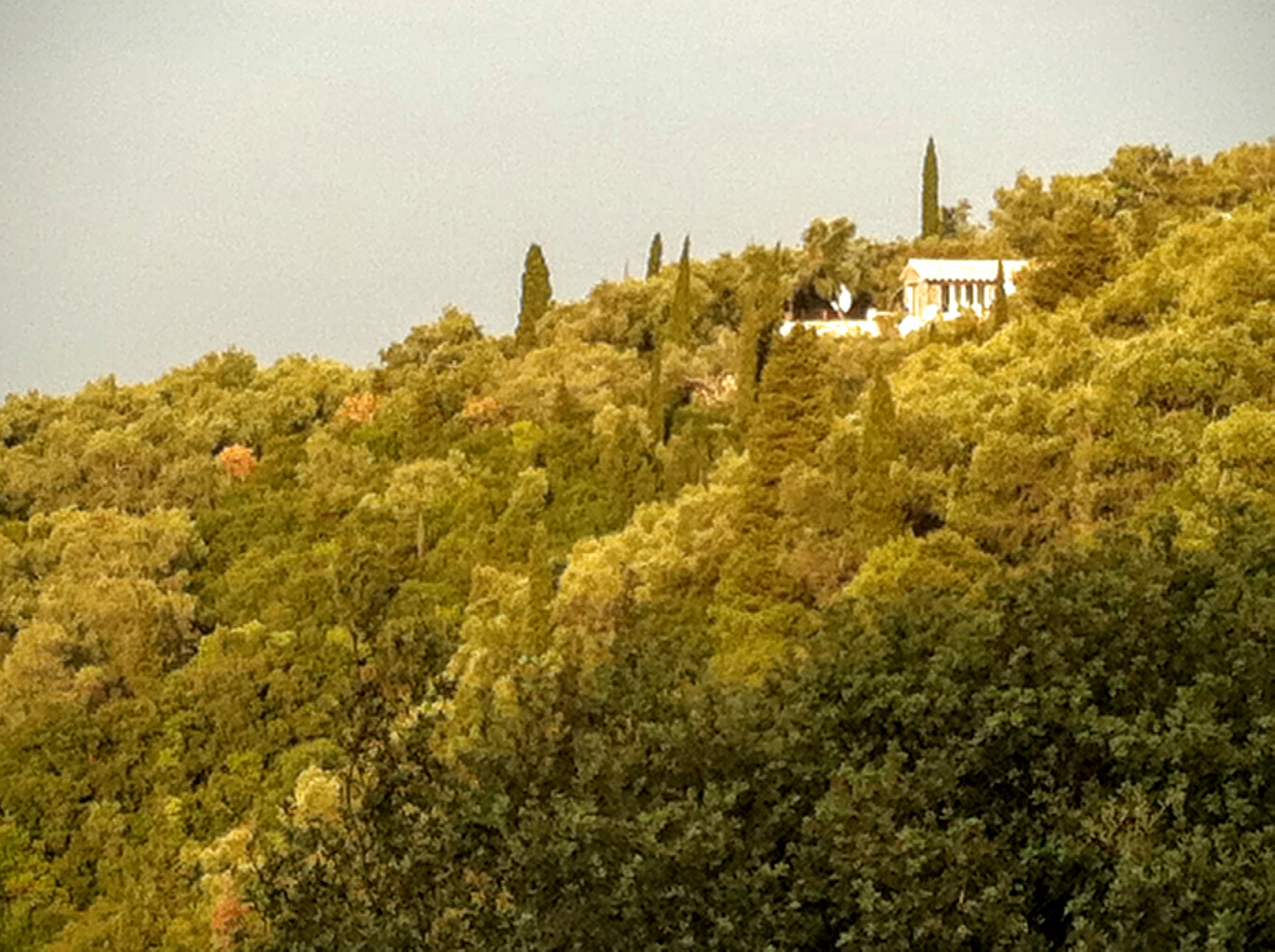Private pool villa on Corfu’s west coast with stone architecture and mountain backdrop