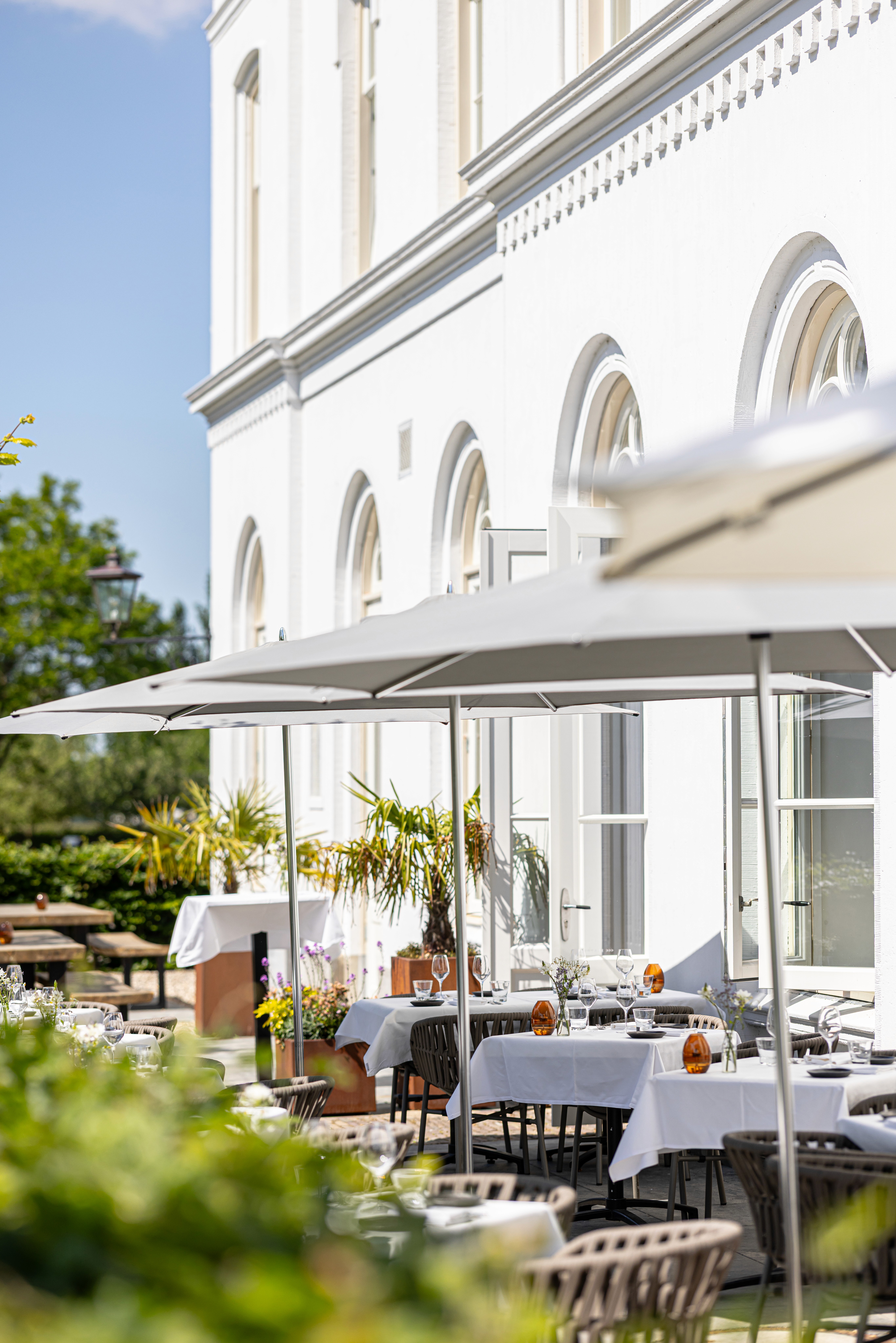 lounge room with large contemporary lamp, cozy sofa and blue toned painting of Venice