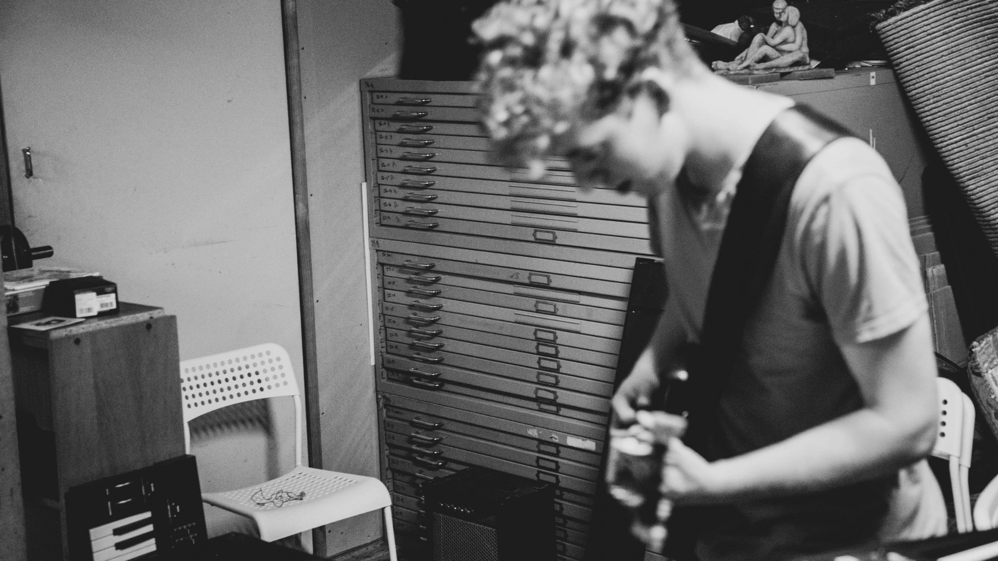 Guitarist playing an electric guitar.
