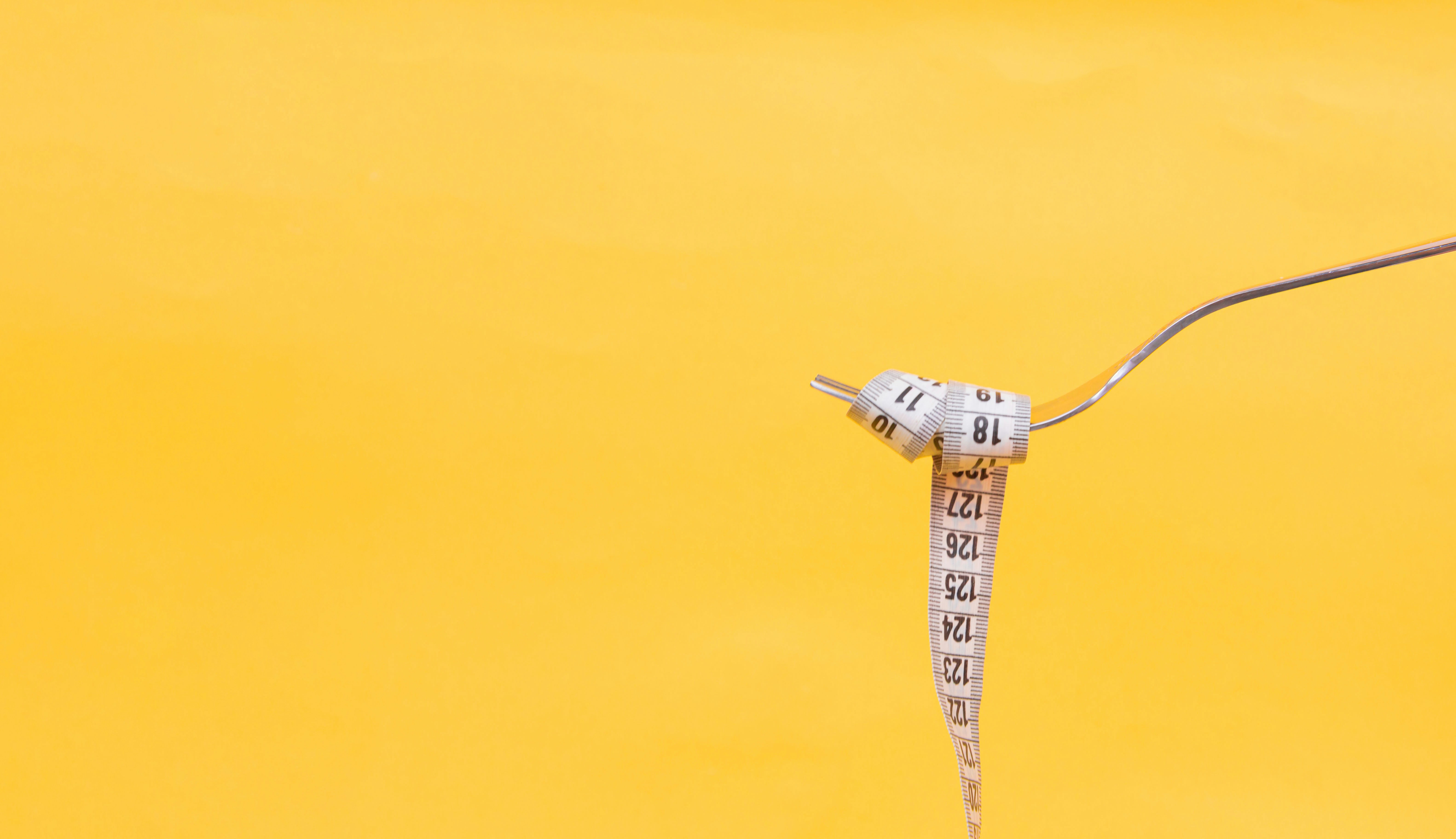 Tape Measure Wrapped Around a Fork