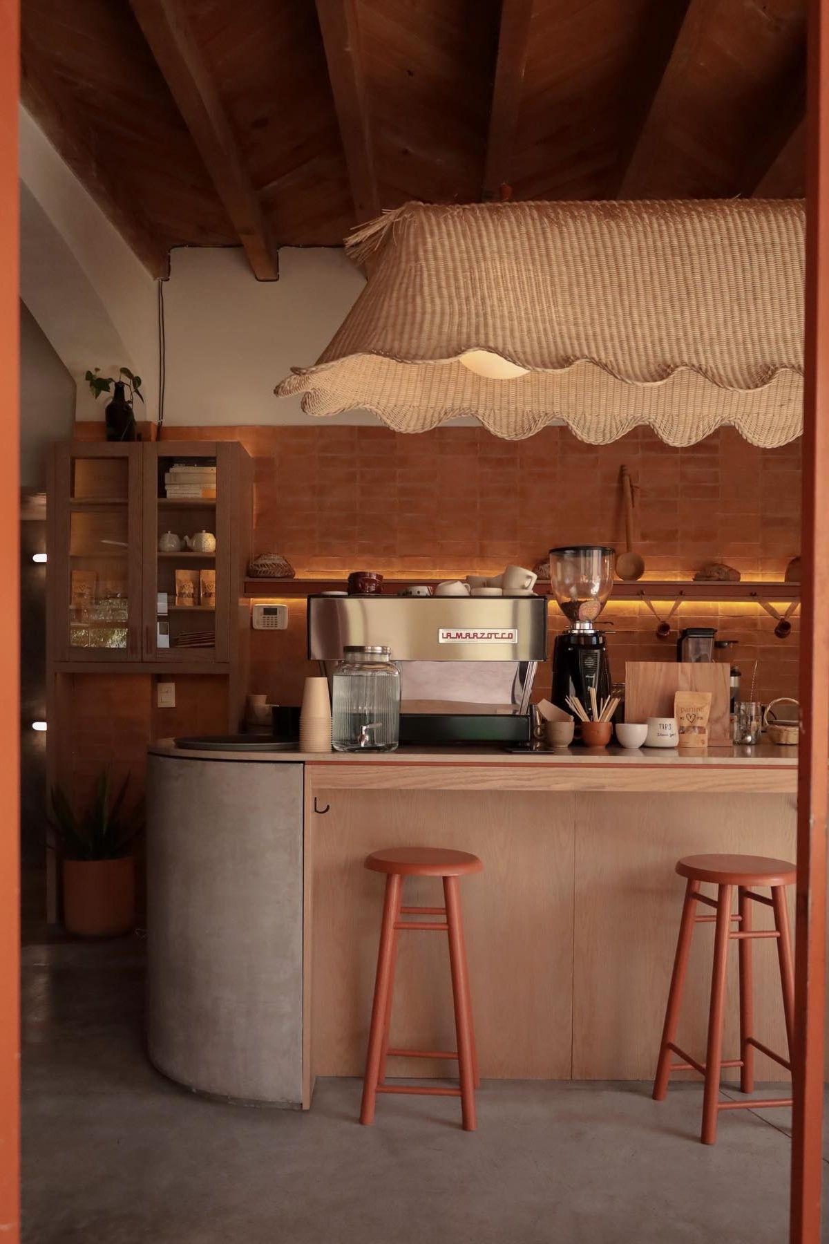 A blurry photo of a person picking berries from a tree