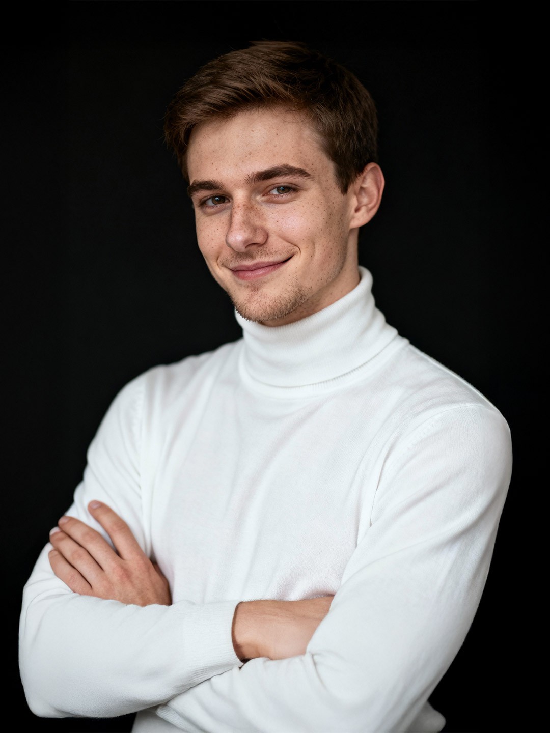 Portrait of a person in dark clothing speaking on a phone