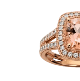 Rose gold ring with a large pink gemstone and smaller diamonds on a white background