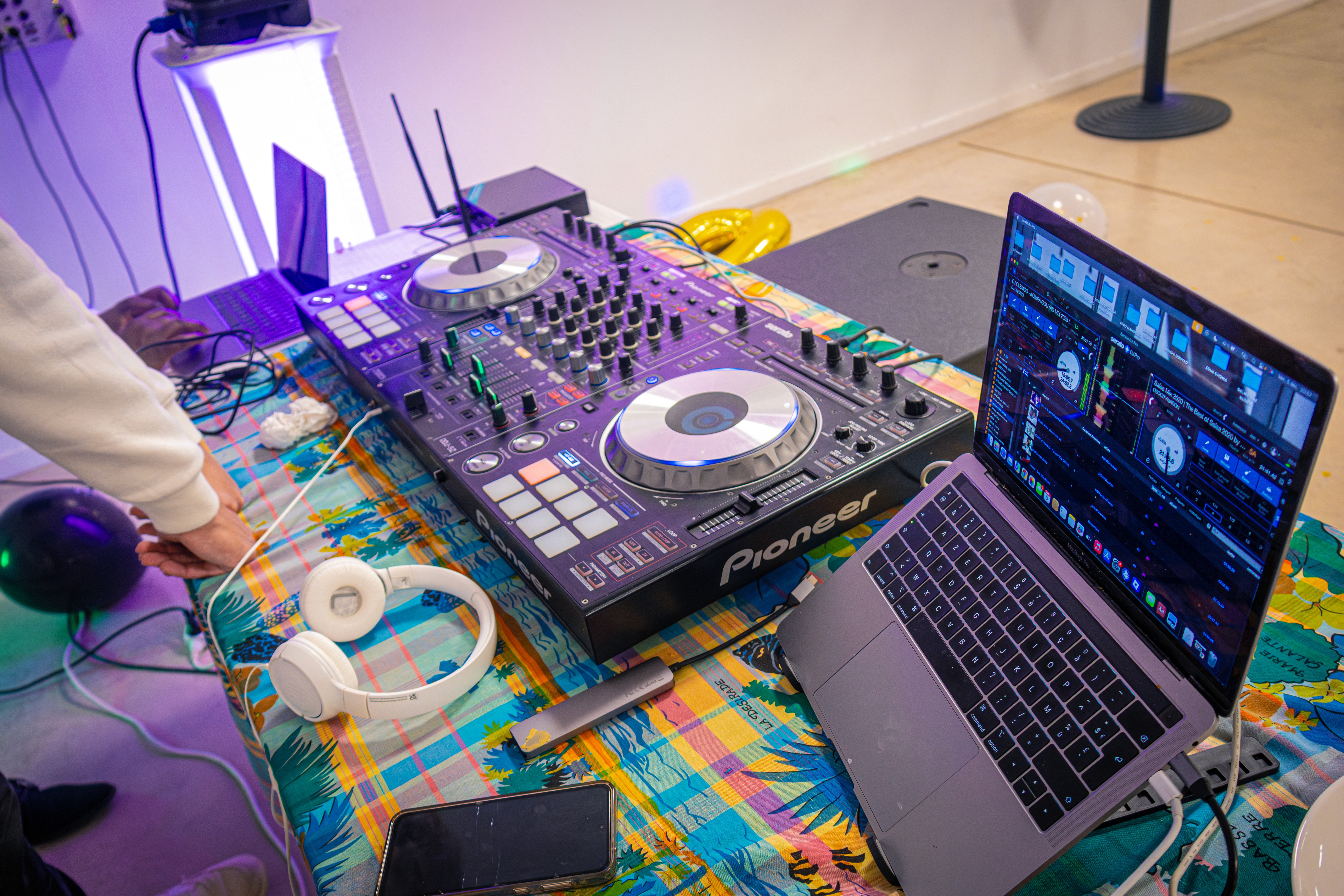 Artistic fashion portrait with colorful floral and avant-garde wallpaper