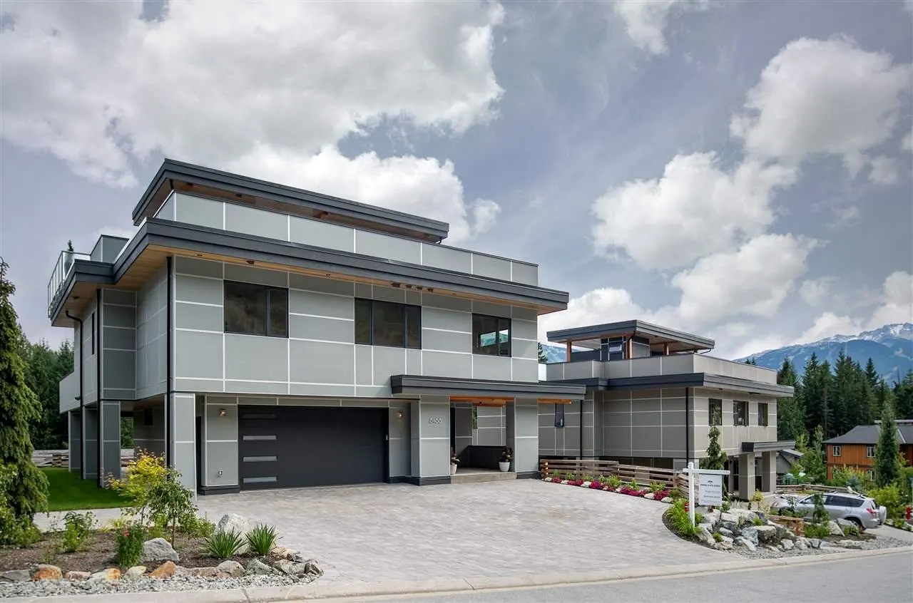 Exterior of the two Bear Paw Trail residences in Whistler, built with a unified design vision.