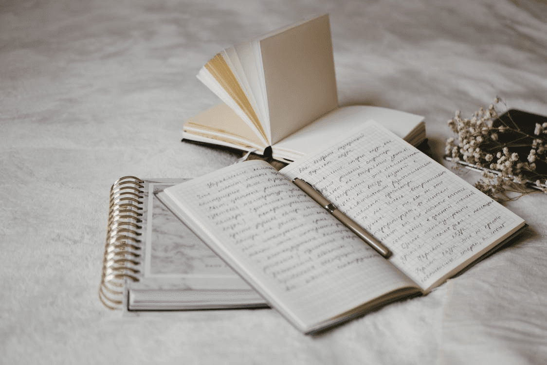 An Open Notebook with Pen