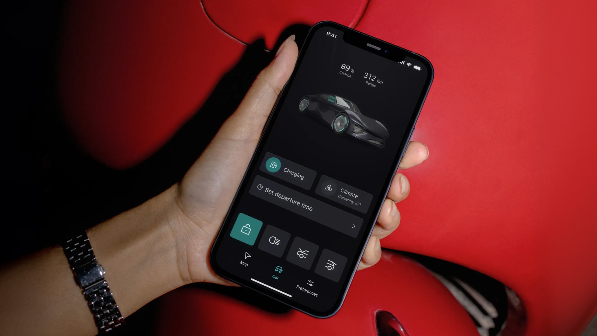 Snapp Automotive companion app held in hand showing charge status and vehicle controls