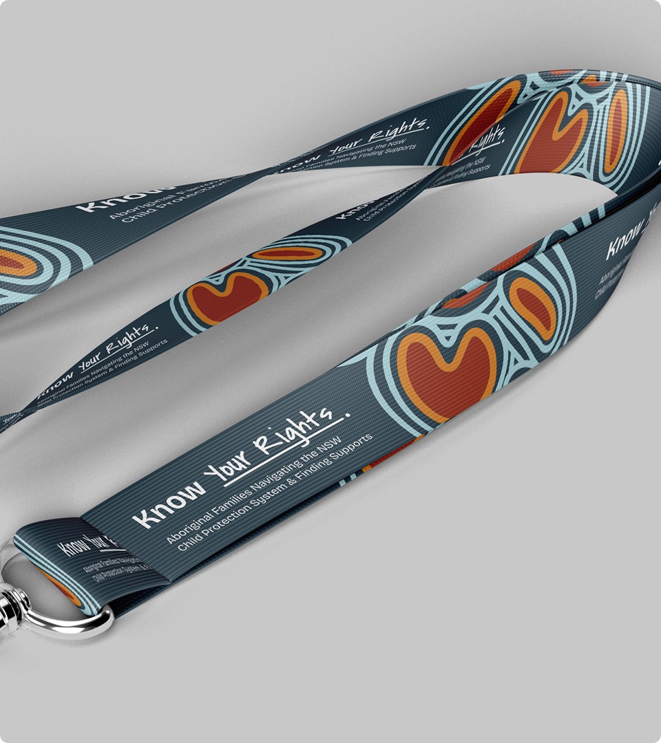 Modern home office setup with a monitor, ergonomic chair, keyboard, and indoor plants near a window with blinds.