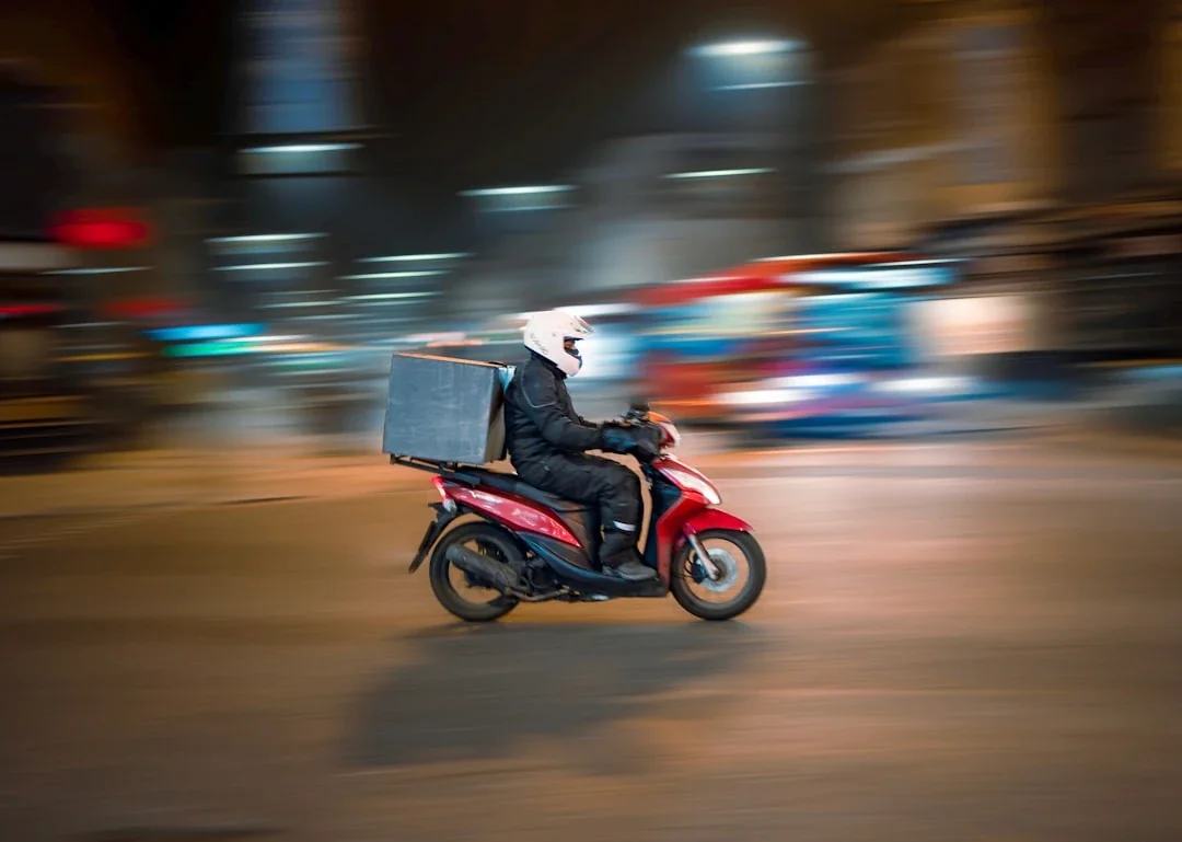 man riding motorcycle on road during daytime