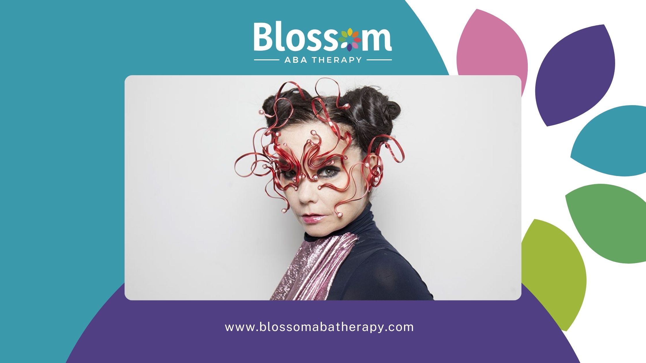 Bjork, suspected with autism, wearing an intricate red artistic mask with a futuristic design.