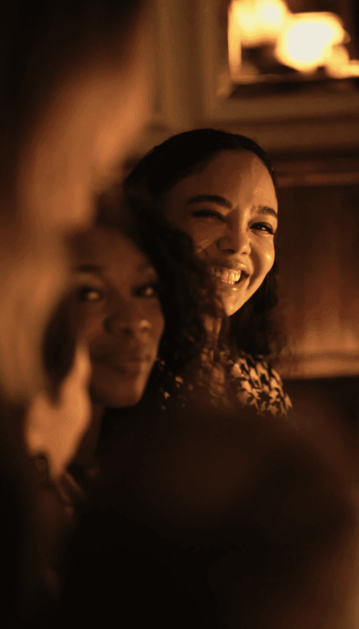 Close-up of bride and groom's torsos, bride in white dress