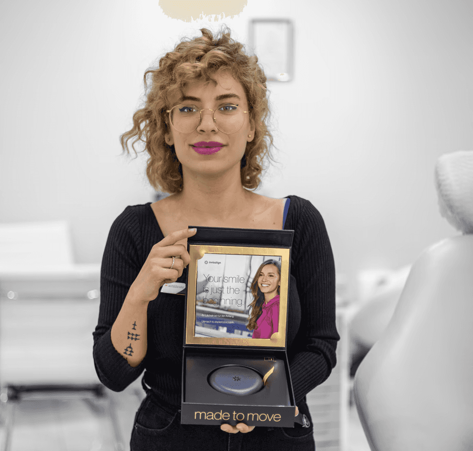 Invisalign starter kit with aligner case and welcome message for orthodontic patients.