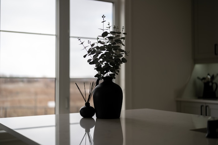 Neutral desk with vase and notebook