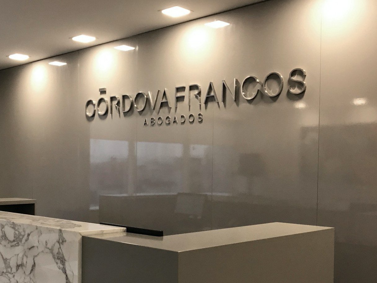 Rooftops of a coastal town with the sea in background