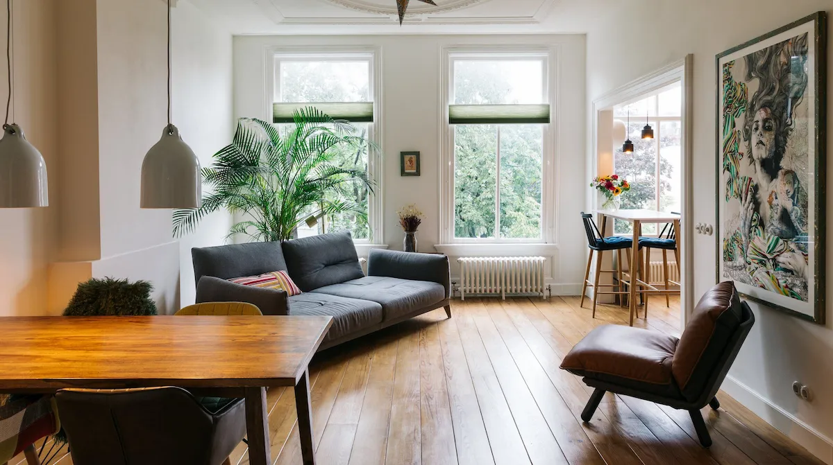 Stylish Amsterdam apartment interior with bookshelves and modern furnishings