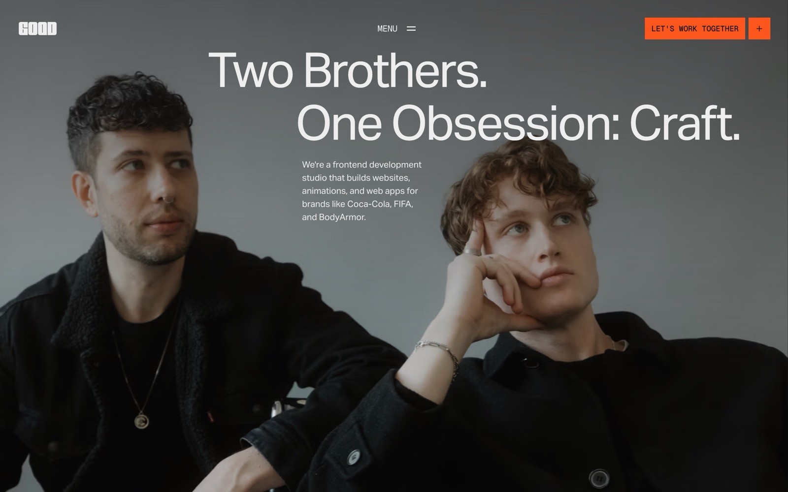 Two men in black jackets sit thoughtfully. Text: "Two Brothers. One Obsession: Craft." Button says "Let's Work Together.
