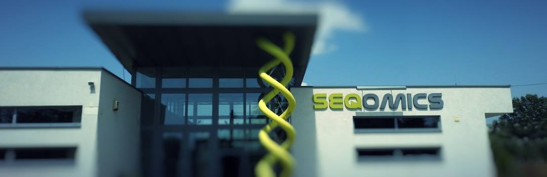 Big modern building with the logo of Seqomics Group
