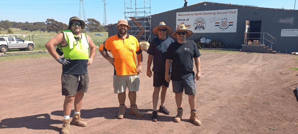 Volunteer groundskeepers maintaining the playing surface at Elcho Park.