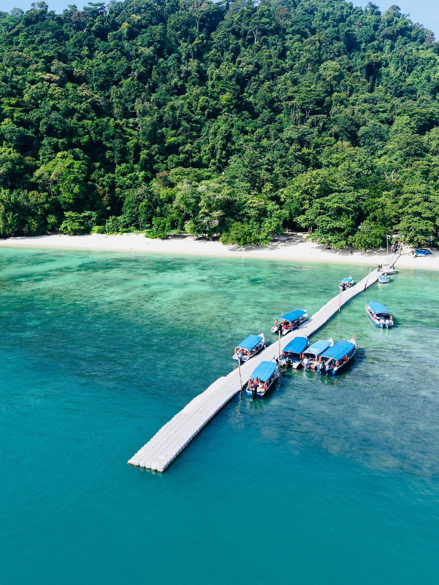 Speedboats at the jetty of Pulau Beras Basah, from above