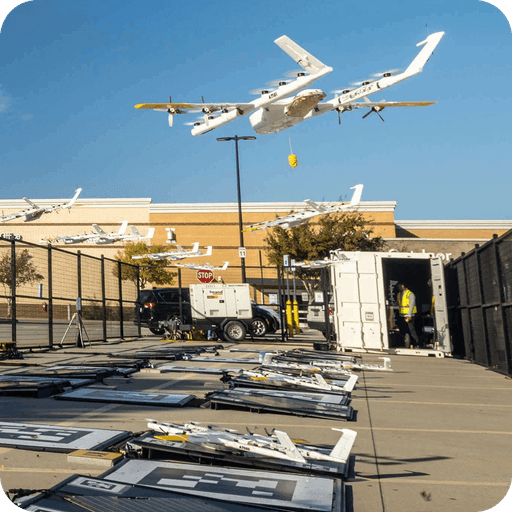 A person in a red uniform places a packaged sushi tray on a counter beside a branded DoorDash delivery container, highlighting food delivery services.