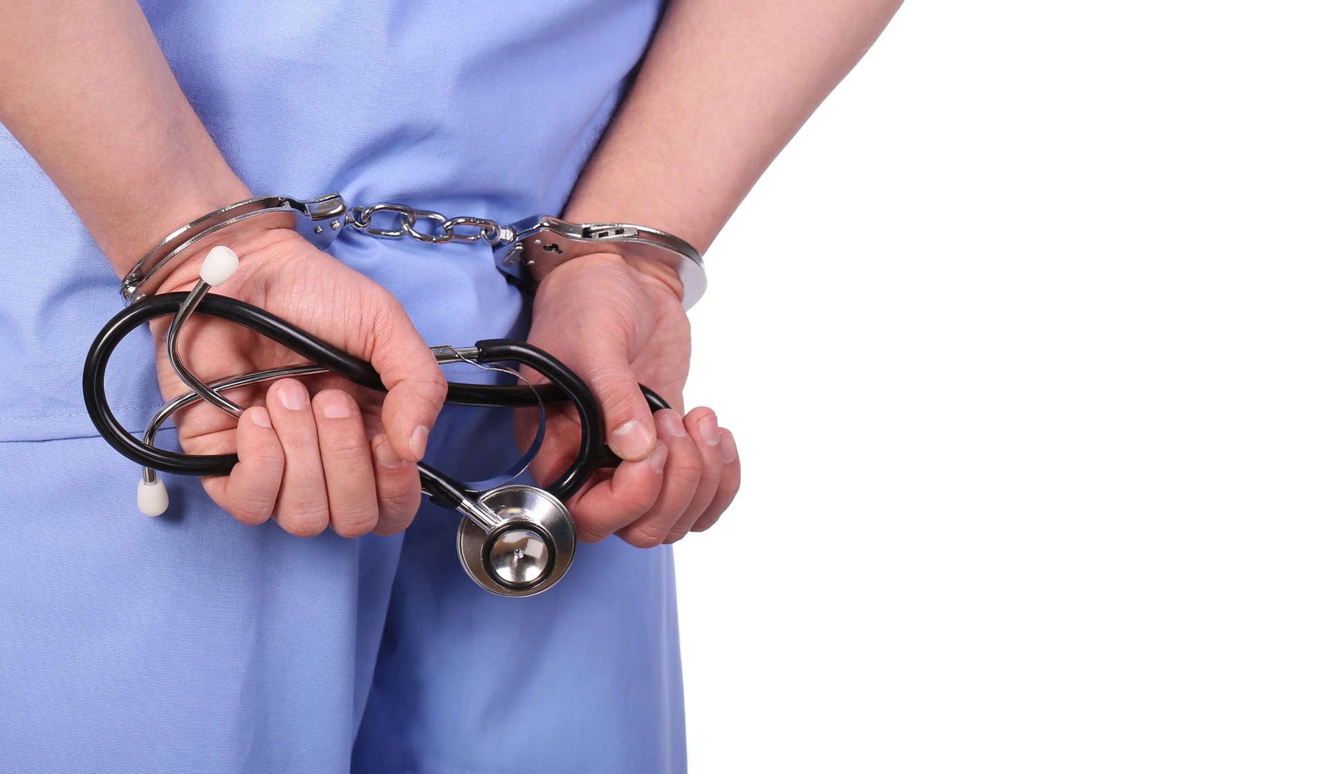 a provider with hands behind his back locked together and a stethoscope in his hands