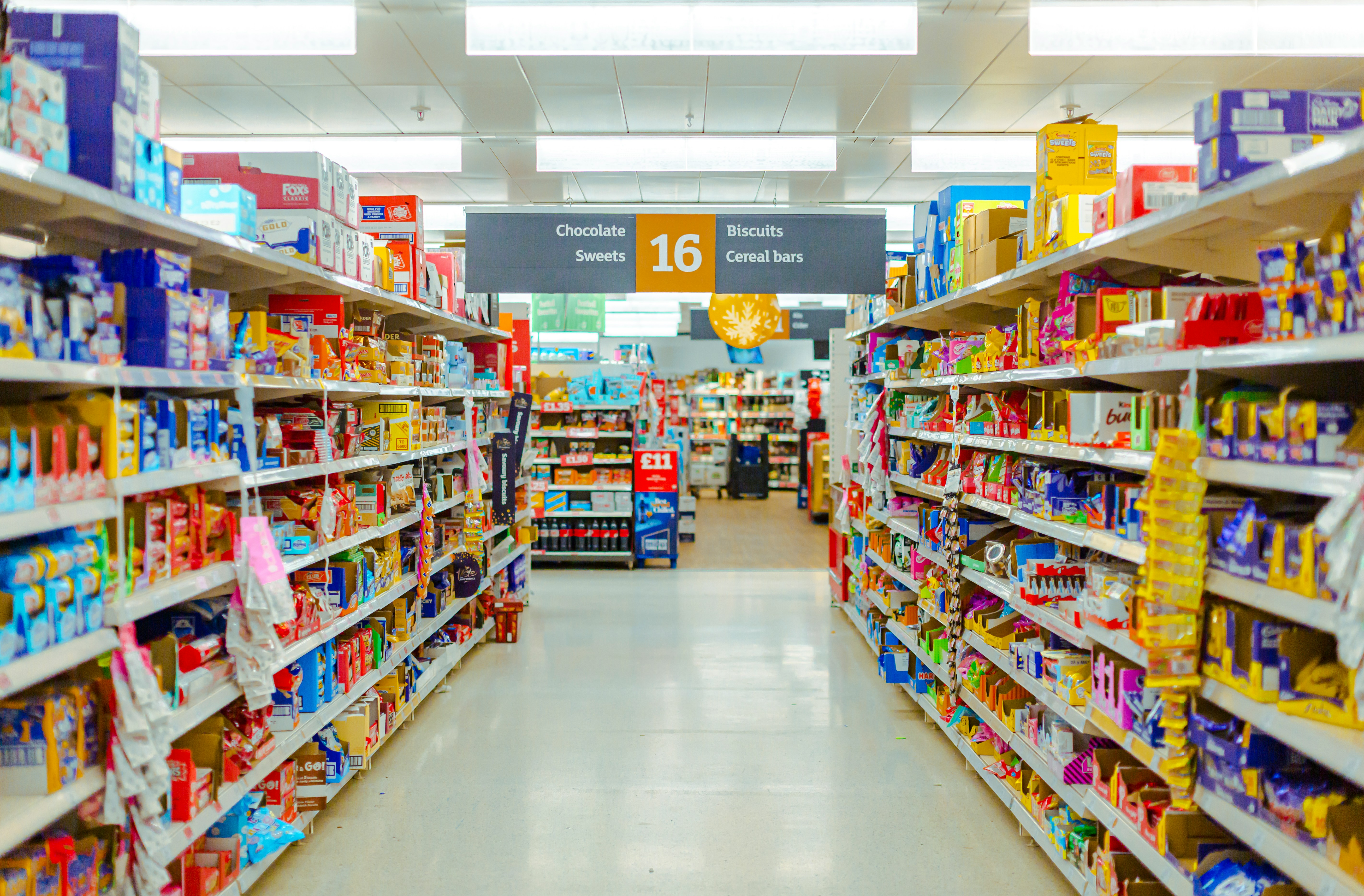 a grocery store aisle filled with lots of food