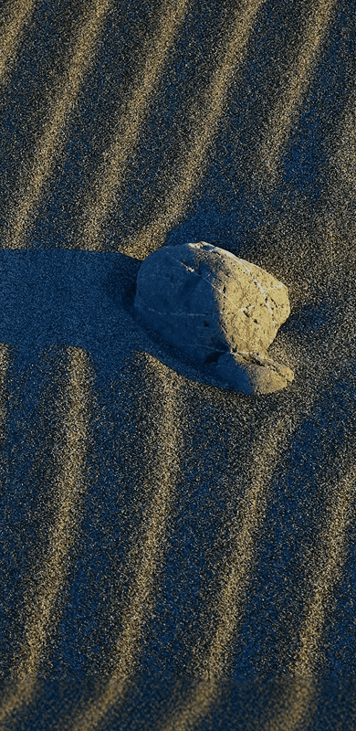 Abstract motion-blurred light patterns in warm gold and green tones against a dark background.