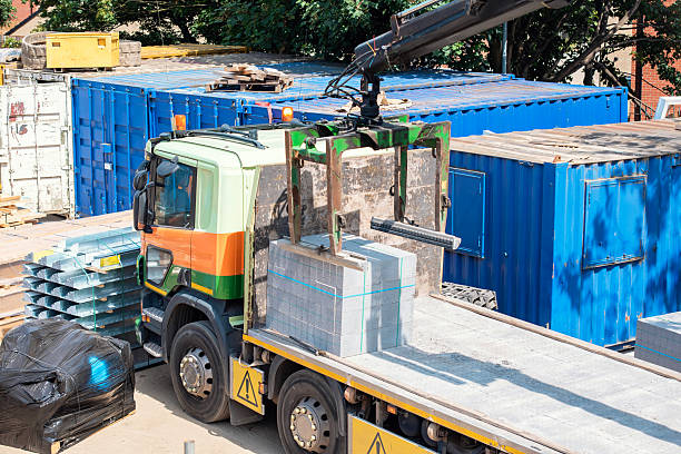 Image of a hiab offloading heavy construction materials 