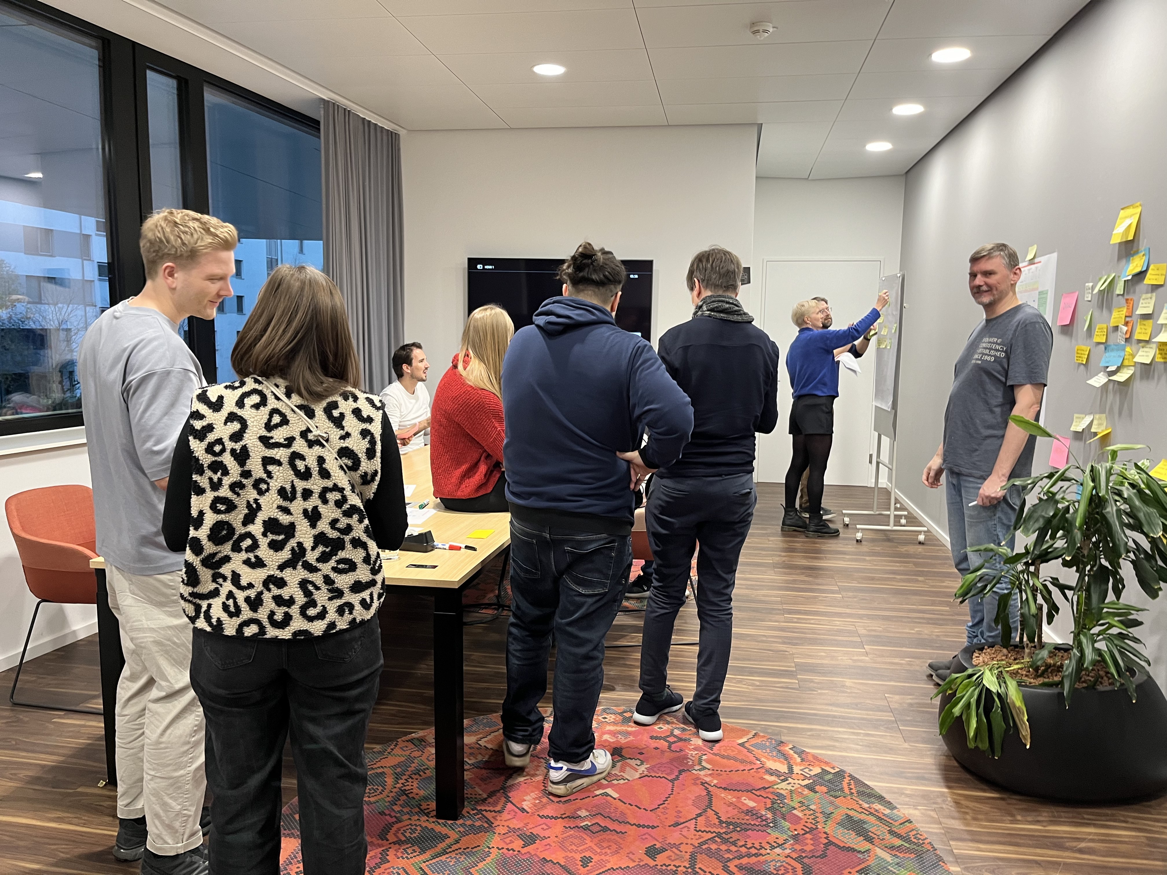 person sitting on grass and using phone