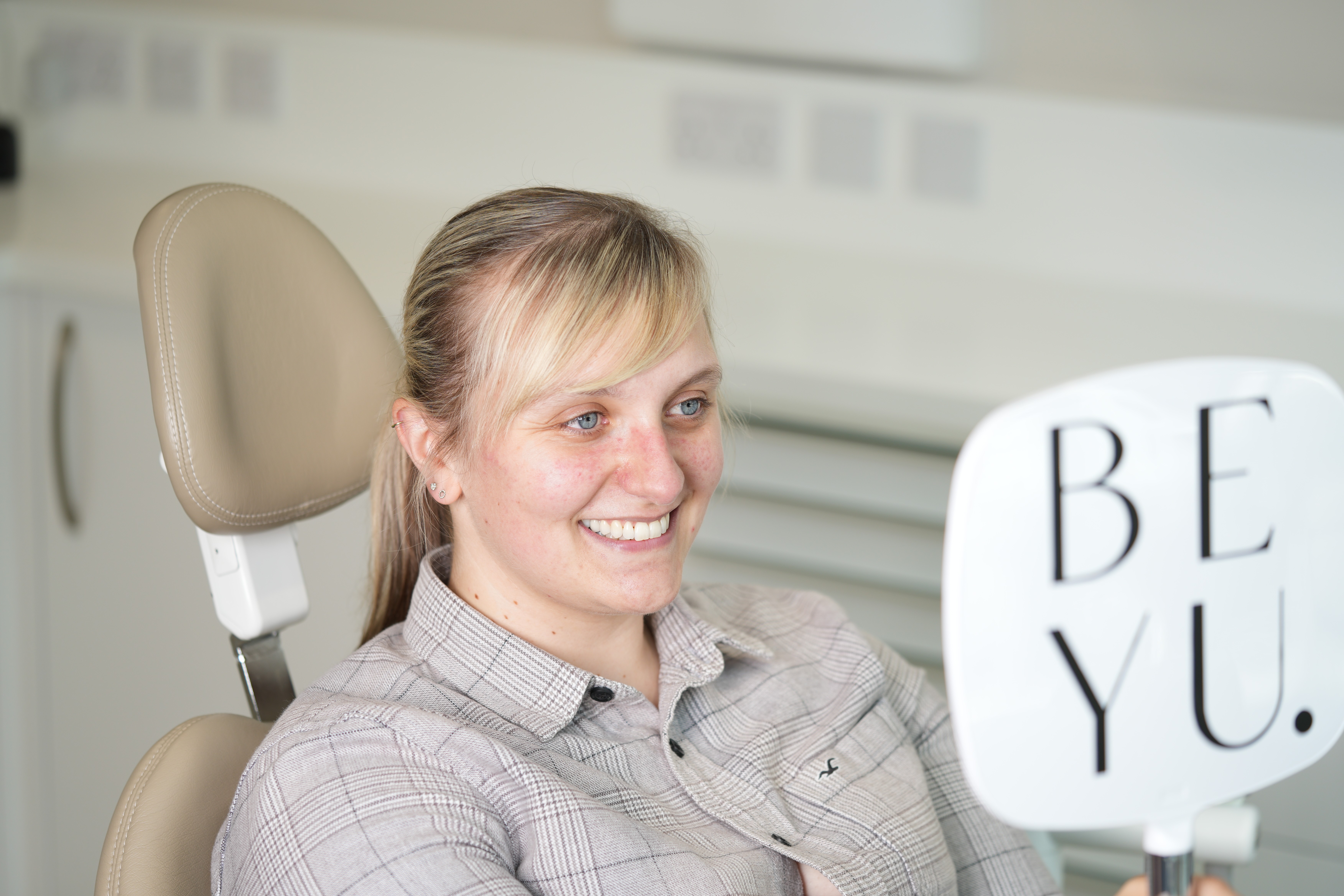 flat lay shot of spa amenities by the bathtub