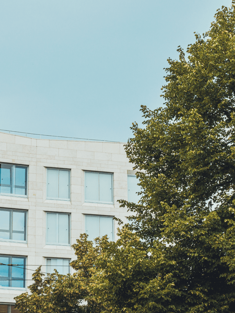 two ladies looking at a laptop and smiling