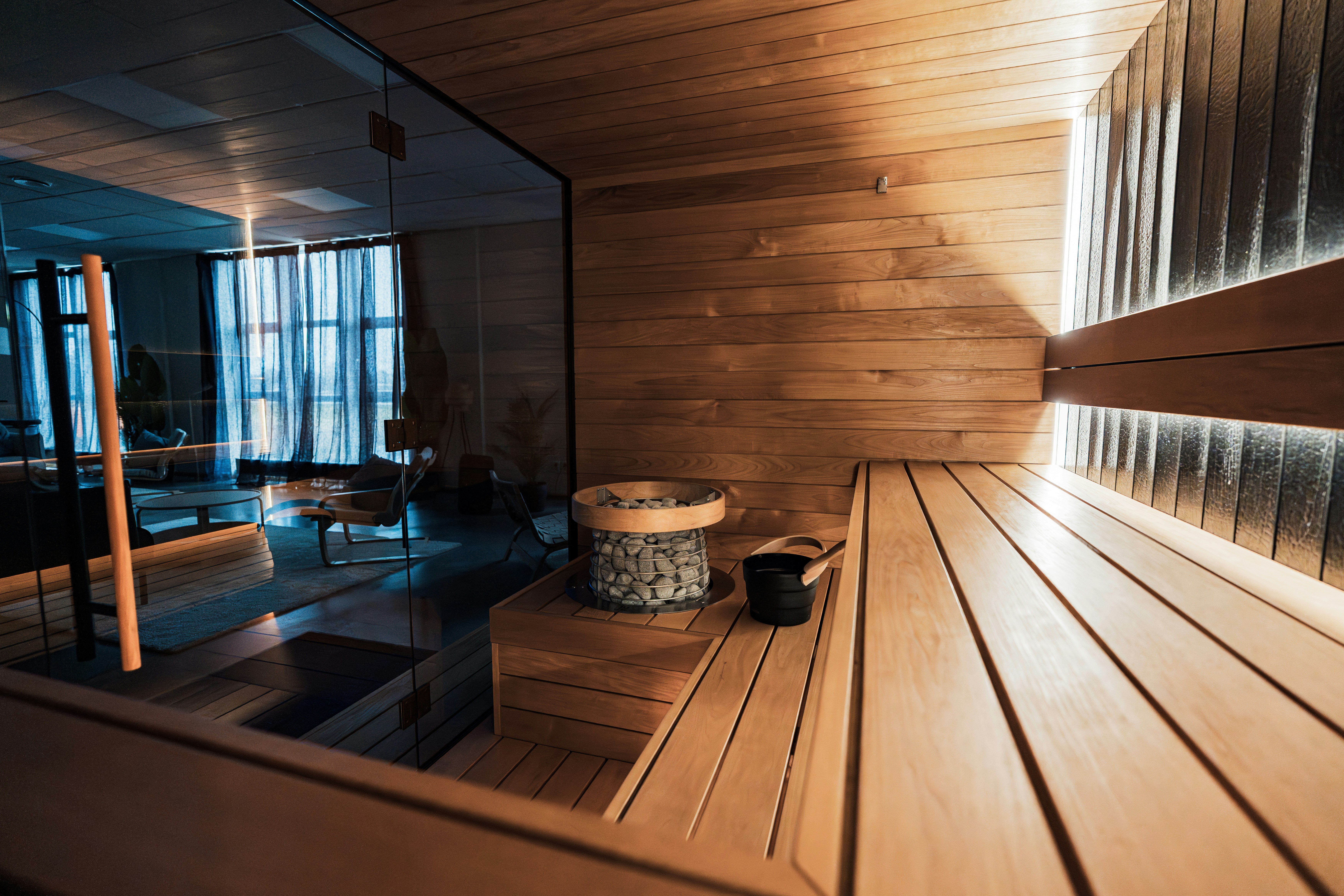 Modern wooden sauna interior with ambient lighting