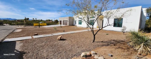 Stucco home with desert landscaping in Tucson