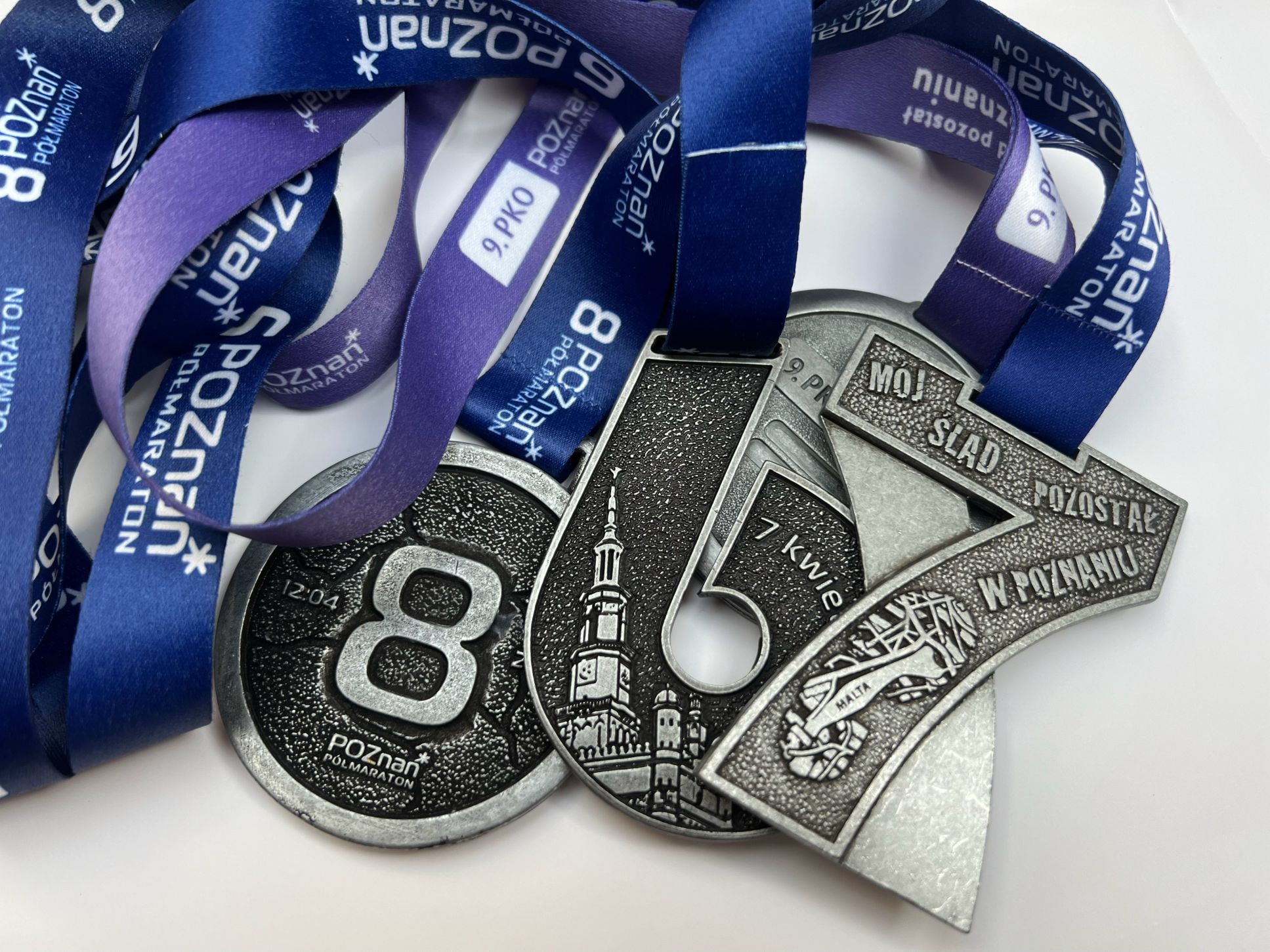 photo of 4 medals from the half marathon