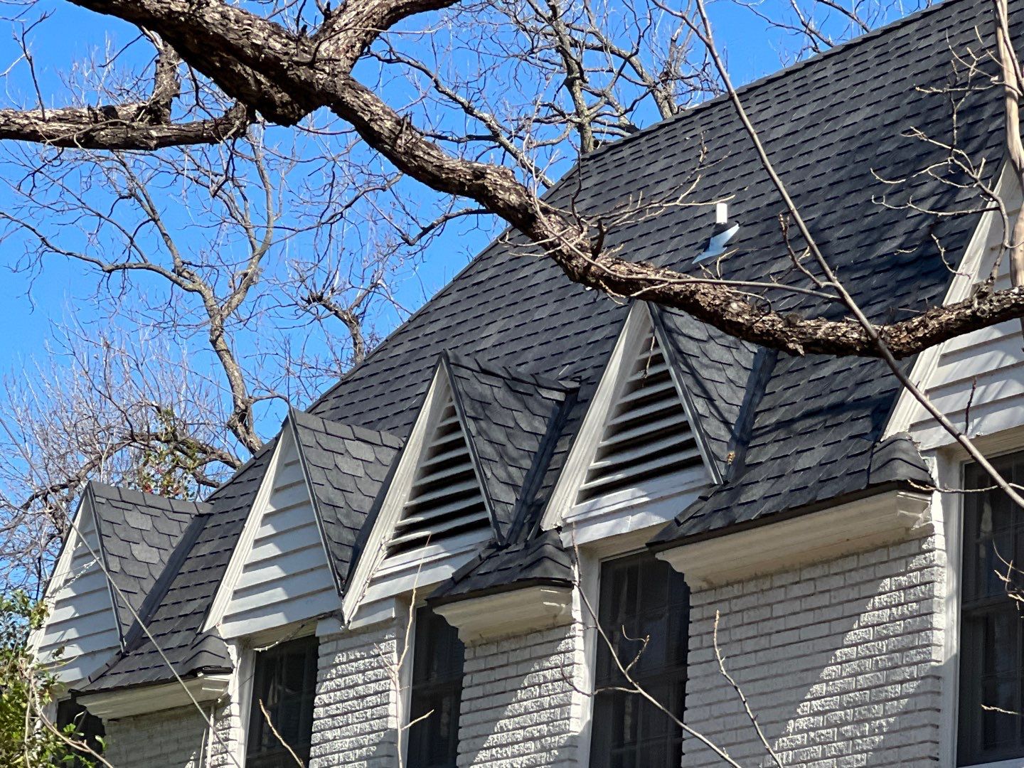Tudor revival home in Highland Park with new synthetic slate roof