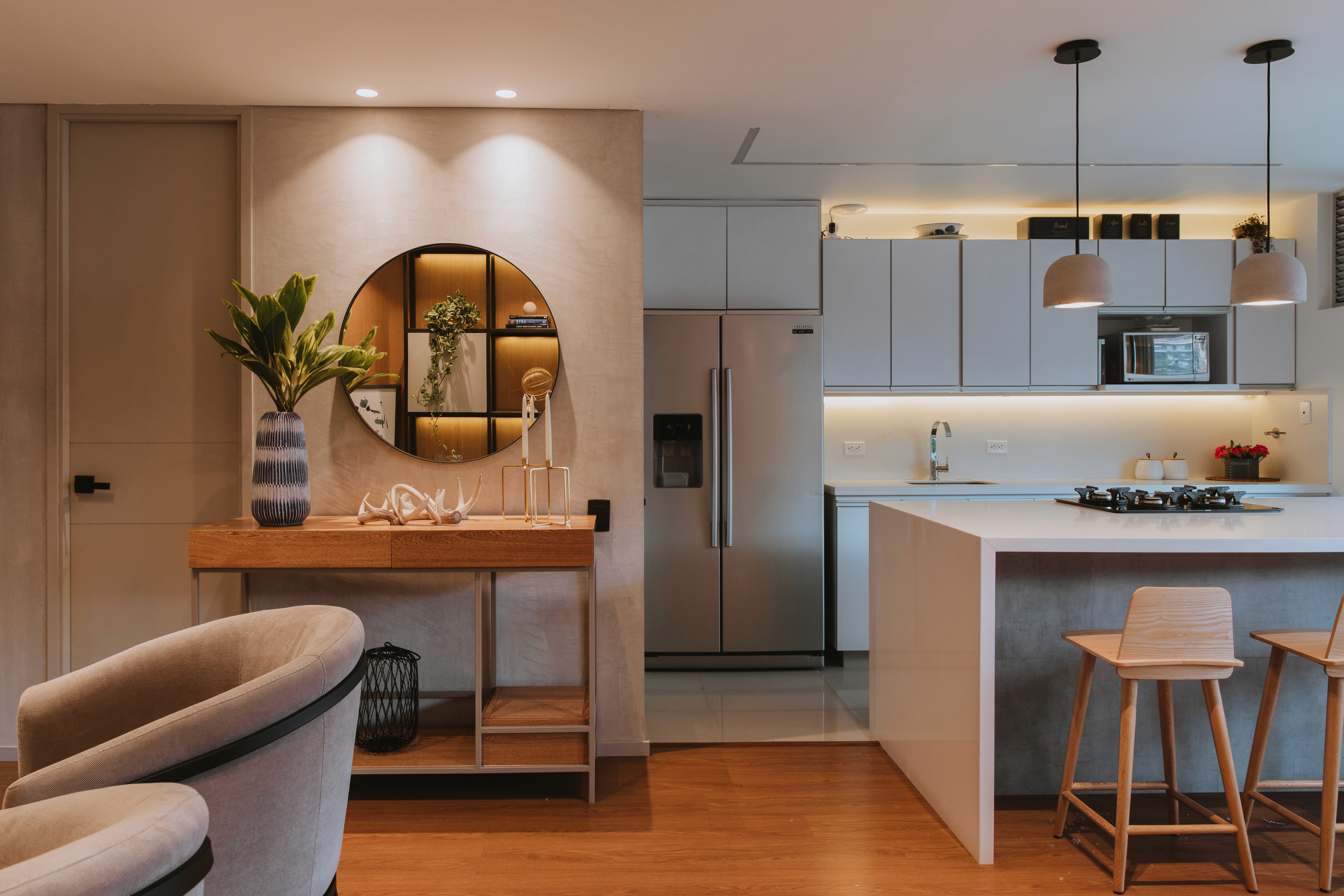 Double-height interior with flowing sculptural forms and warm raking light