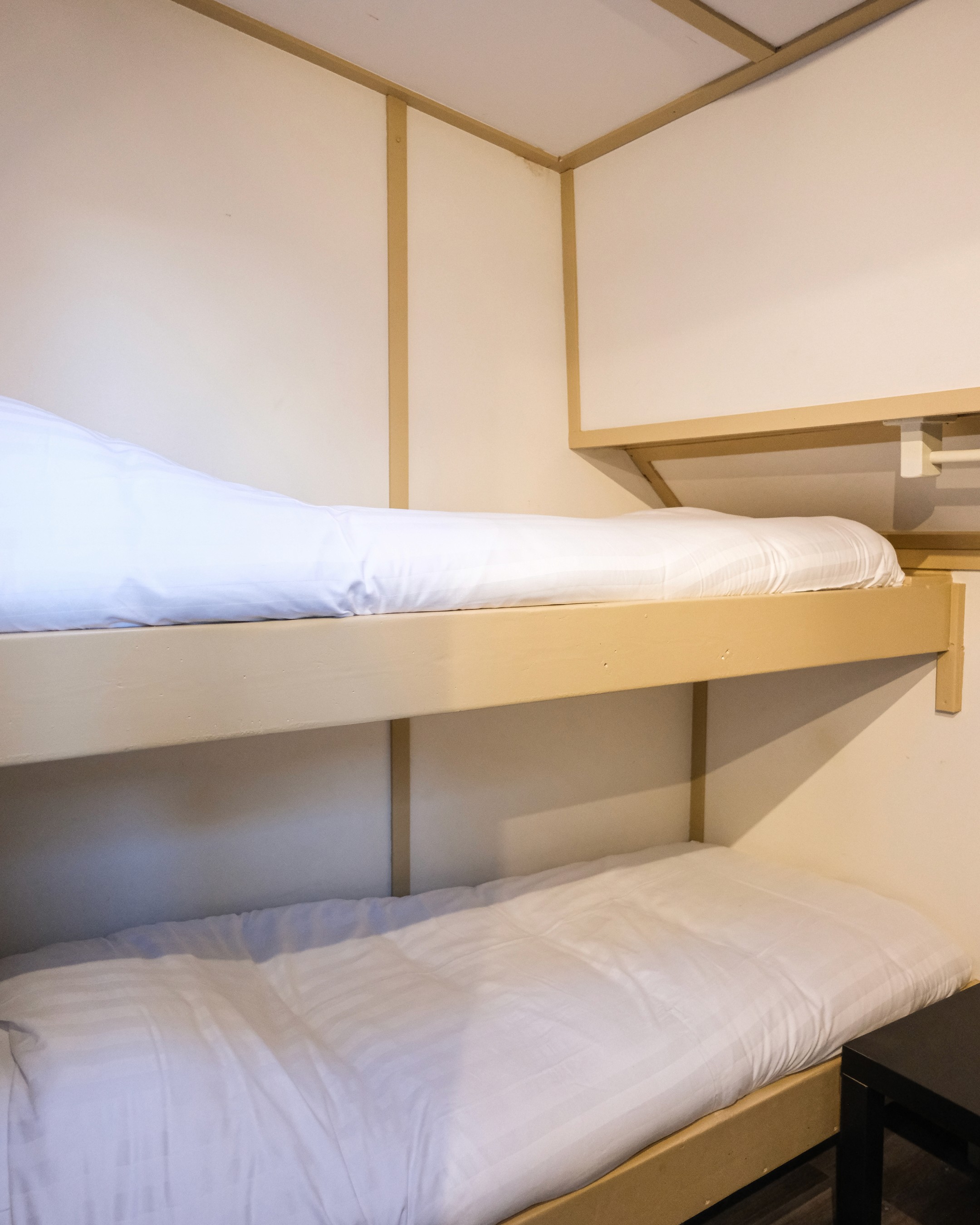 Classic bedroom with canopy bed and patterned pillows