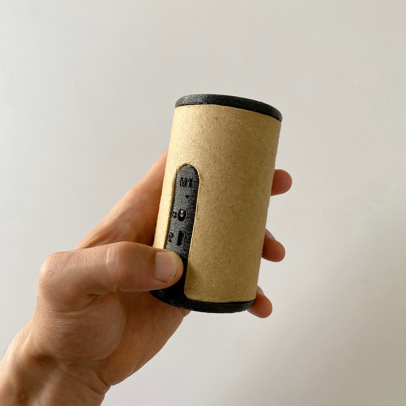 a wireless yellow charger in hand