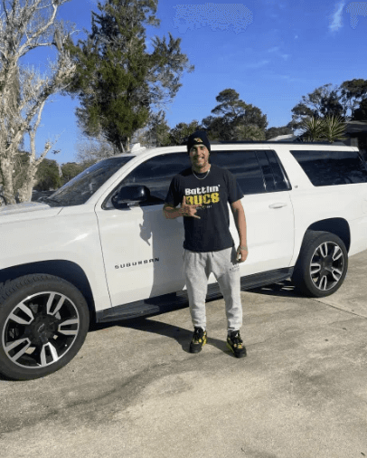 An image of a FlipFlip member purchasing a truck cash with his profits wearing the FlipFlip merch.