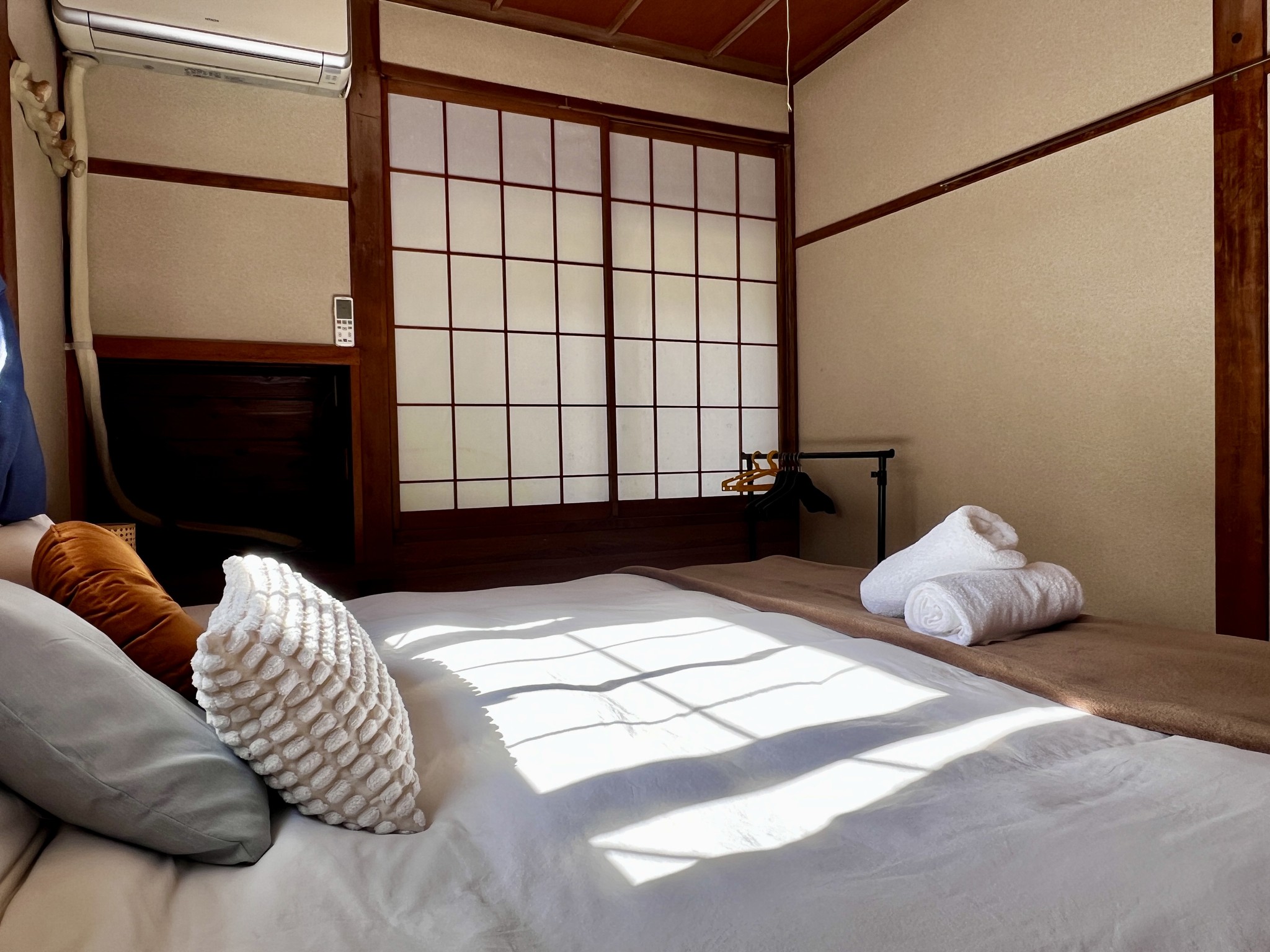 A cosy room with traditional Japanese design elements. The twin beds can be joined to create a spacious king bed. Ideal for couples or friends seeking a cultural experience.