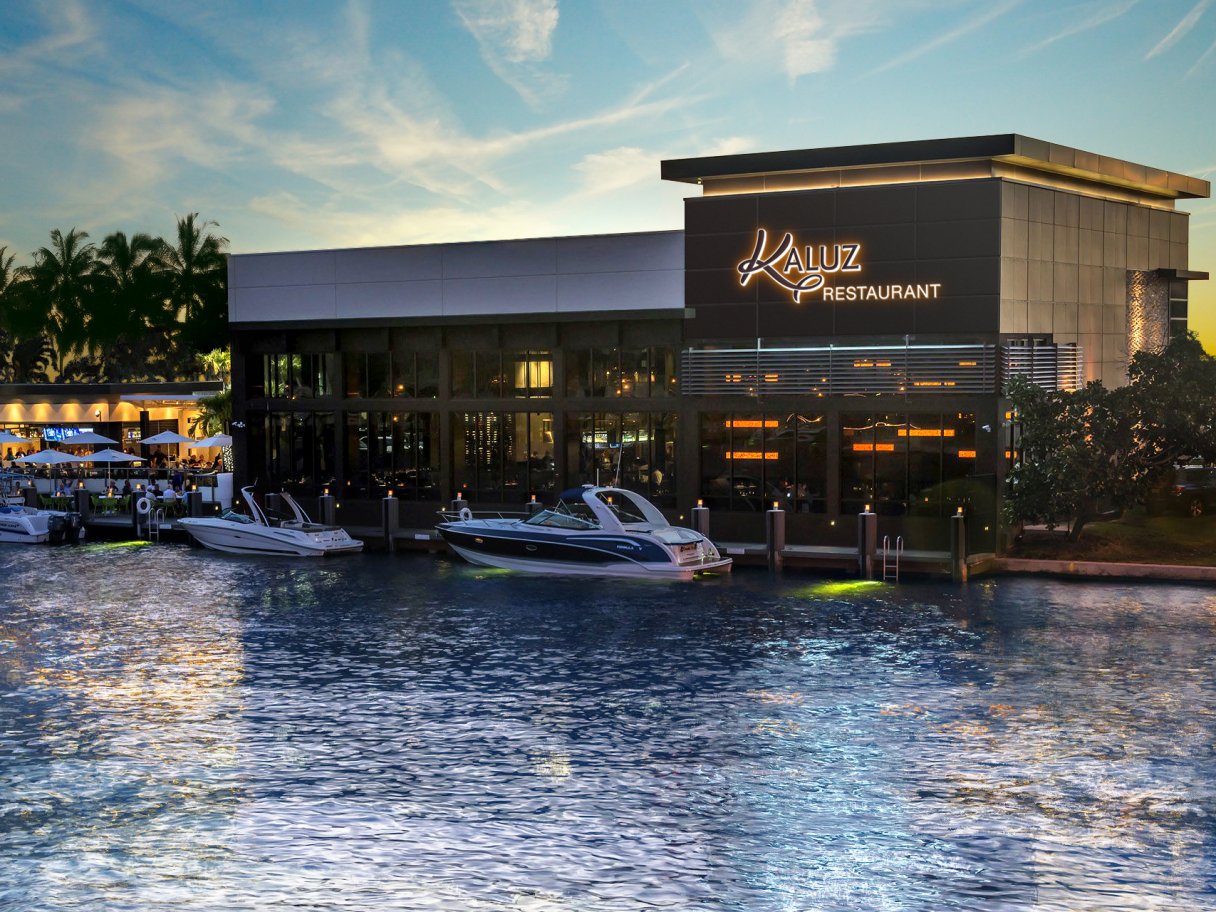 Rooftops of a coastal town with the sea in background