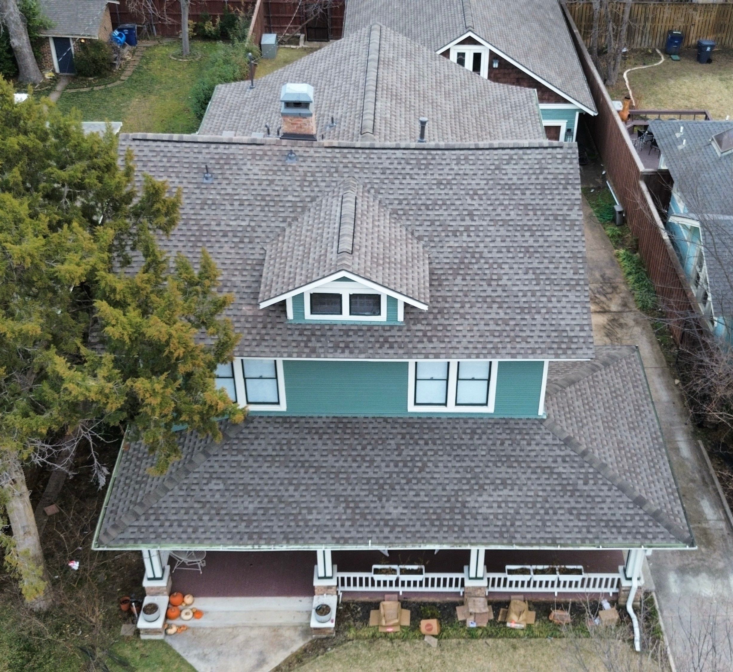 Front-on aerial of a Winnetka Heights craftsman bungalow in Oak Cliff after the GAF Timberline Armorshield II roof replacement