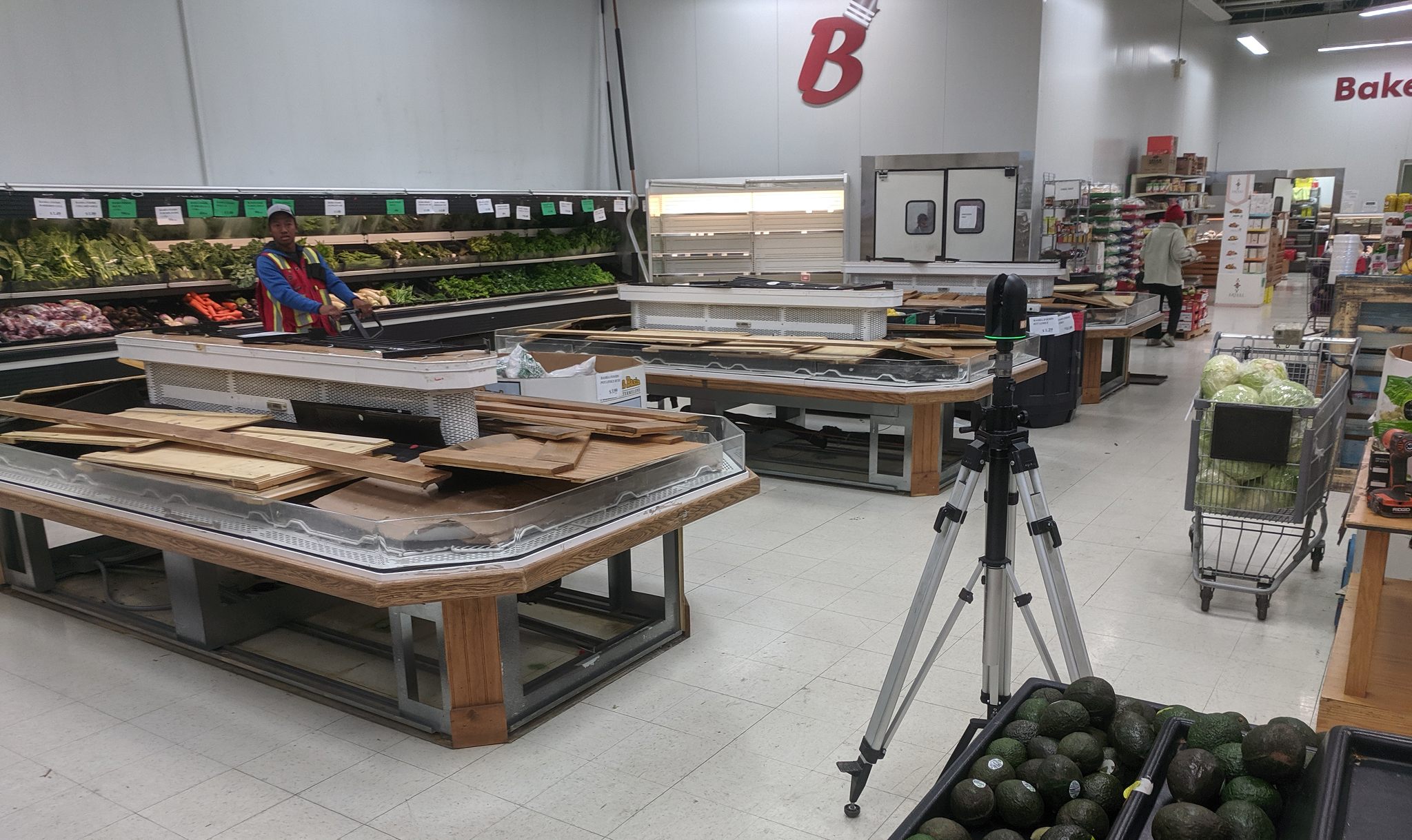 3D laser scanner surveying the retail floor to assess flood damage and grading
