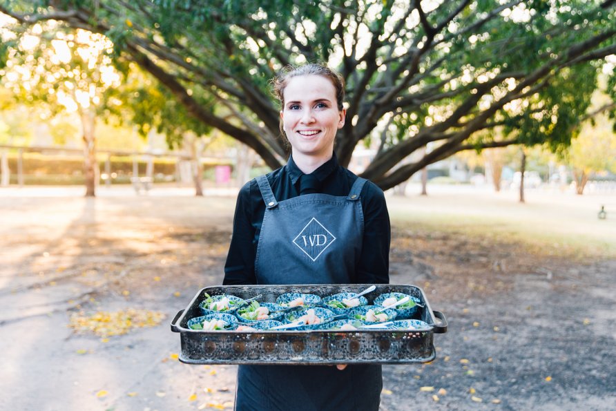Waitstaff holding tray of substantial canapes in small bowls