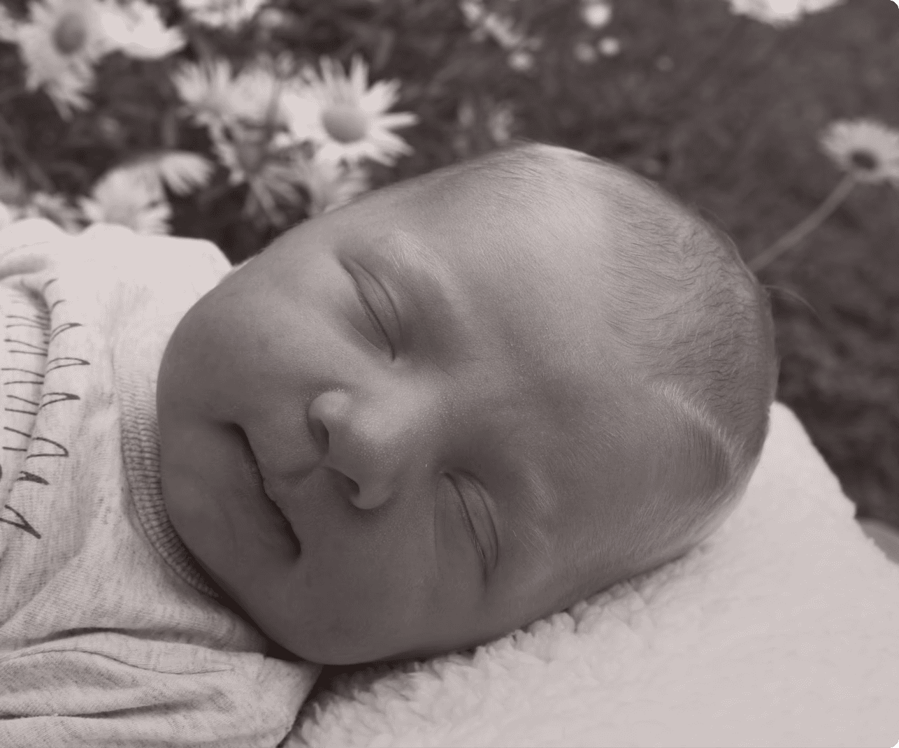 Baby boy sleeping in Garden